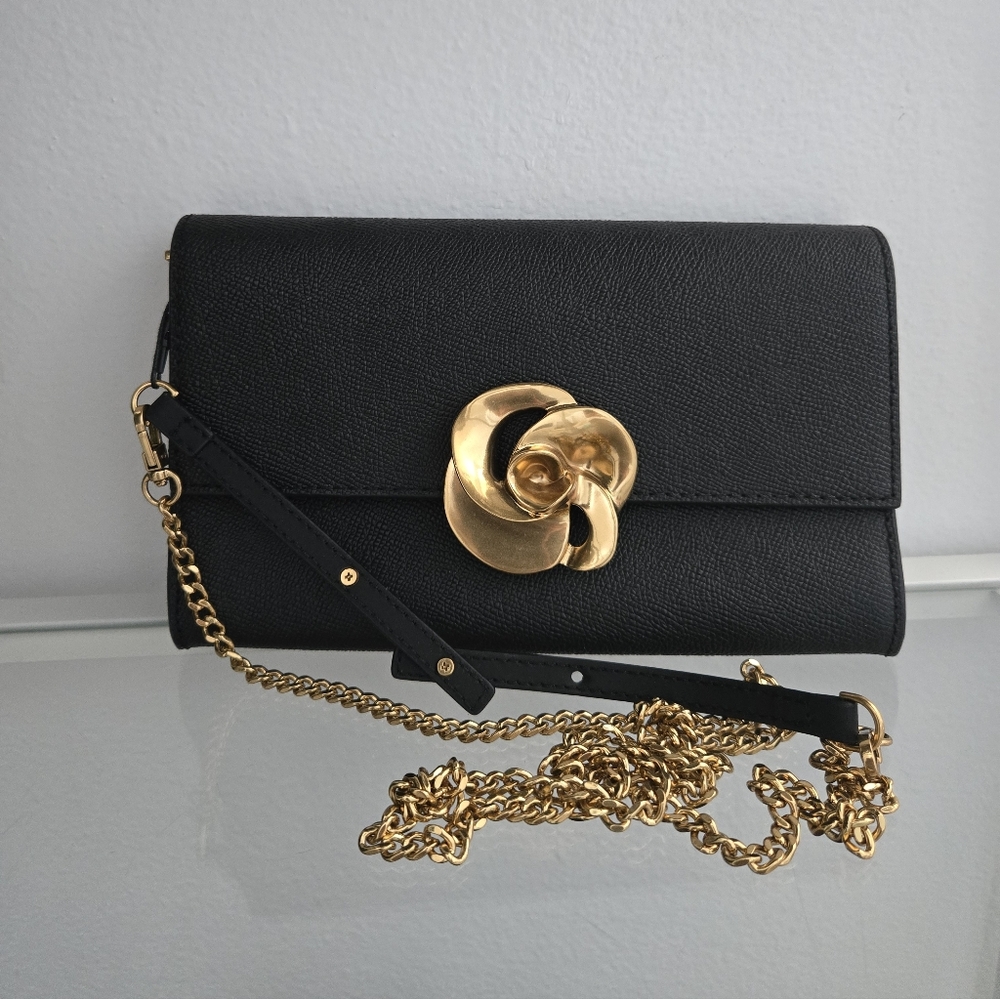 Ted Baker Elegant Black Clutch with Gold Accent